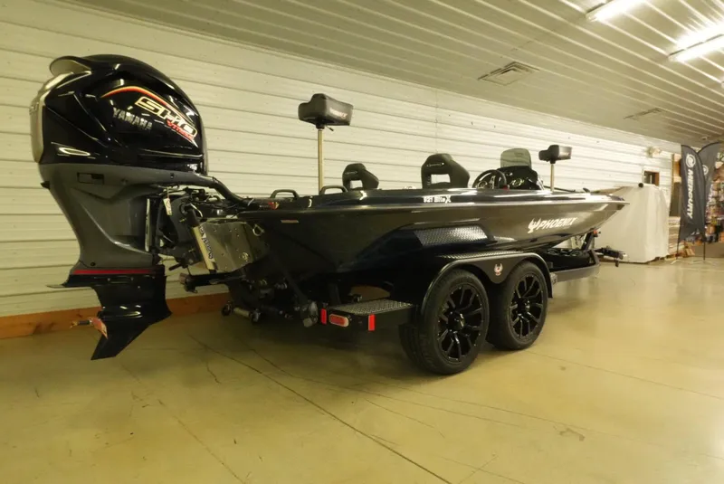 Slide: The Image of 2026 Phoenix 921 Elite X boat with Yamaha engine in showroom. - 6