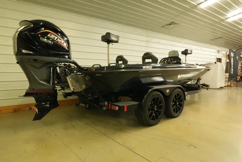 Slide: The Image of 2026 Phoenix 921 Elite X boat with Yamaha engine in indoor showroom. - 7