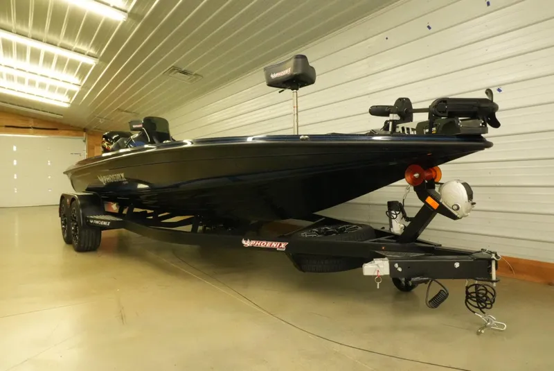 Slide: The Image of 2026 Phoenix 921 Elite X boat in a garage, showcasing sleek design and advanced features. - 8