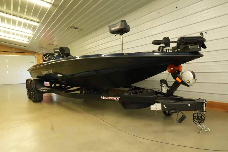 Slide: The Image of 2026 Phoenix 921 Elite X boat on trailer in indoor storage facility. - 9