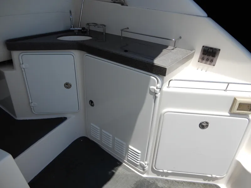 Slide: The Image of 2006 Regal Commodore 3760 IO boat kitchenette with sink and storage cabinets. - 11