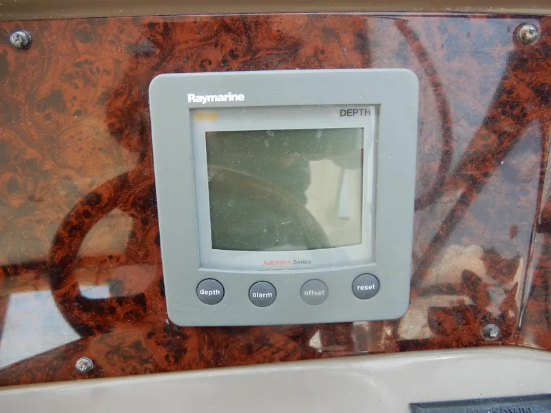 Slide: The Image of Raymarine depth gauge on 2006 Regal Commodore 3760 IO boat dashboard. - 23