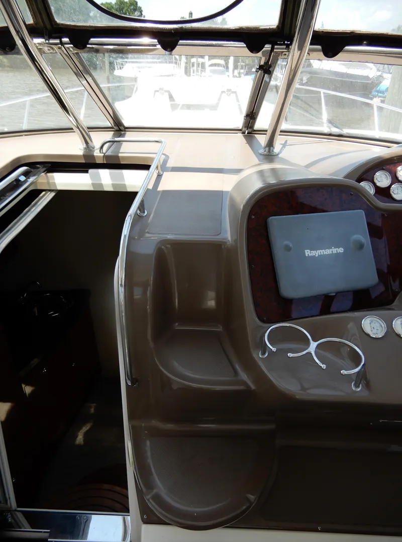 Slide: The Image of 2006 Regal Commodore 3760 IO boat cockpit with Raymarine navigation system. - 25