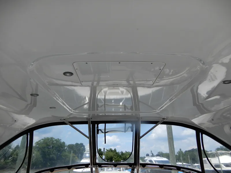 Slide: The Image of 2006 Regal Commodore 3760 IO boat interior ceiling with windows and outdoor view. - 28