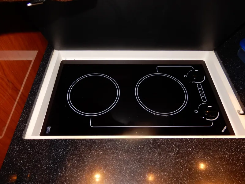 Slide: The Image of Built-in electric stove on 2006 Regal Commodore 3760 IO yacht kitchen. - 37