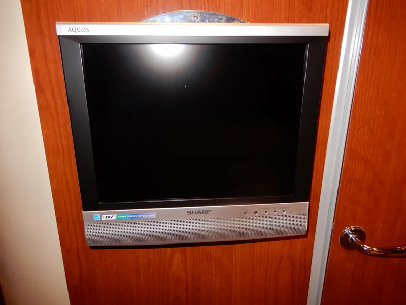 Slide: The Image of Sharp Aquos TV mounted on wood panel in 2006 Regal Commodore 3760 IO. - 38