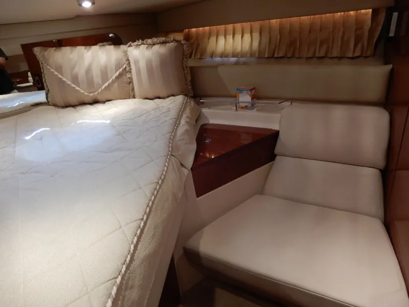 Slide: The Image of Luxurious interior of 2006 Regal Commodore 3760 IO yacht with bed and seating area. - 41