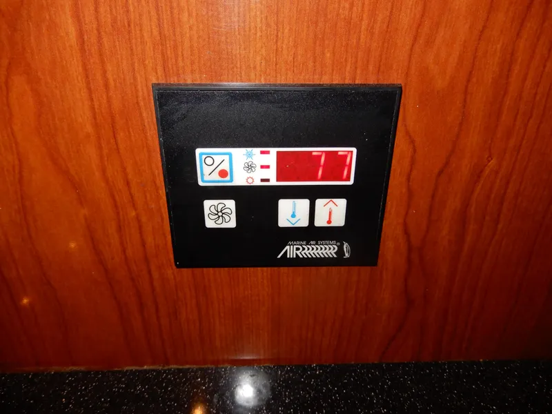 Slide: The Image of Control panel on 2006 Regal Commodore 3760 IO boat, displaying temperature settings. - 44