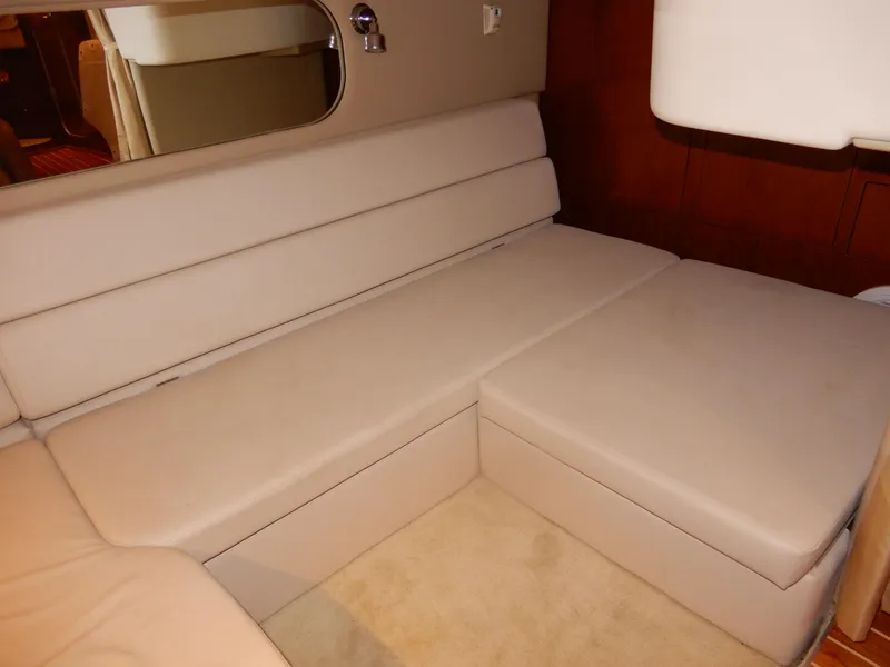 Slide: The Image of 2006 Regal Commodore 3760 IO interior with beige seating and mirror. - 47