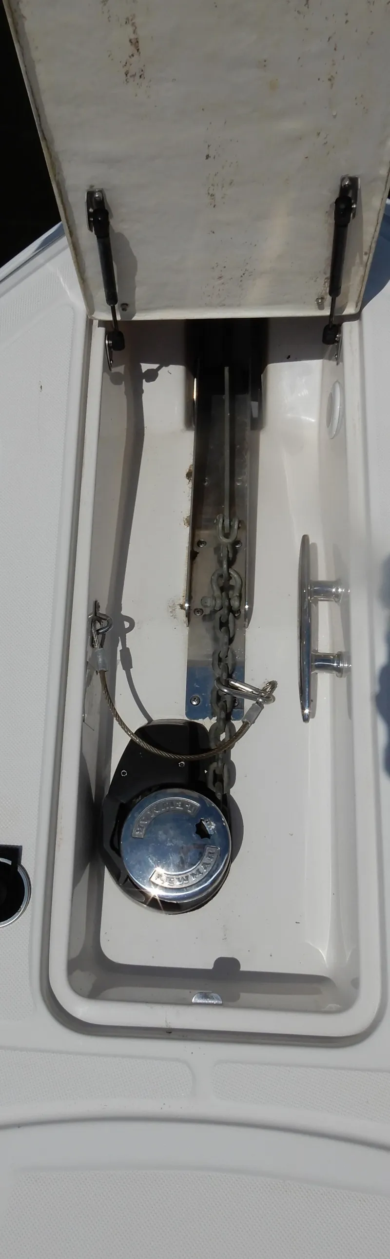 Slide: The Image of Anchor compartment of 2006 Regal Commodore 3760 IO boat, featuring chain and cleat. - 6