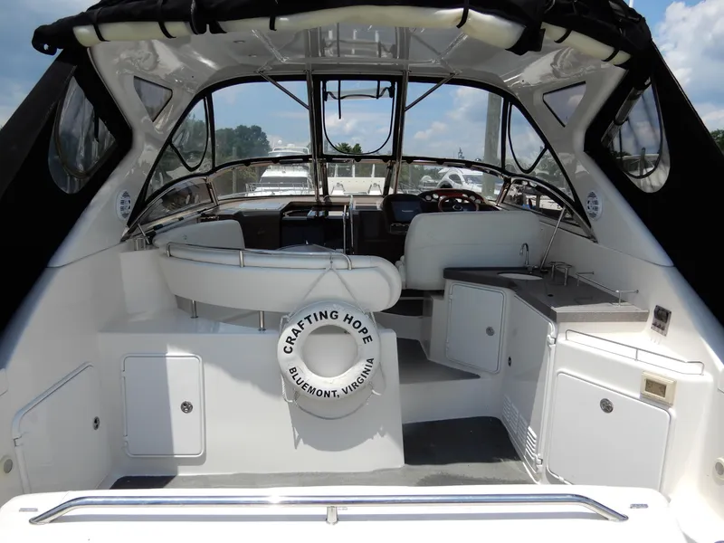 Slide: The Image of 2006 Regal Commodore 3760 IO boat interior with seating, sink, and life preserver. - 7
