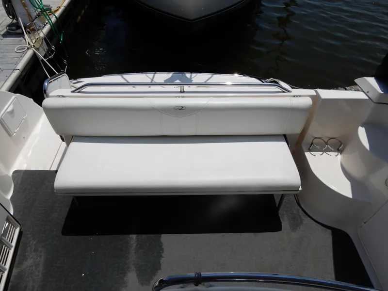 Slide: The Image of 2006 Regal Commodore 3760 IO boat with white seating on deck. - 8