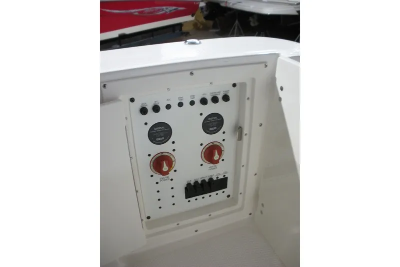 Slide: The Image of Control panel of 2026 Robalo R270 Center Console boat, featuring switches and gauges. - 19