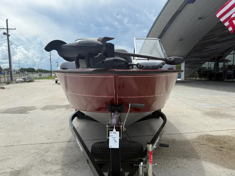 Slide: The Image of 2015 Tracker Targa V18 Combo boat on trailer, parked outdoors. - 3