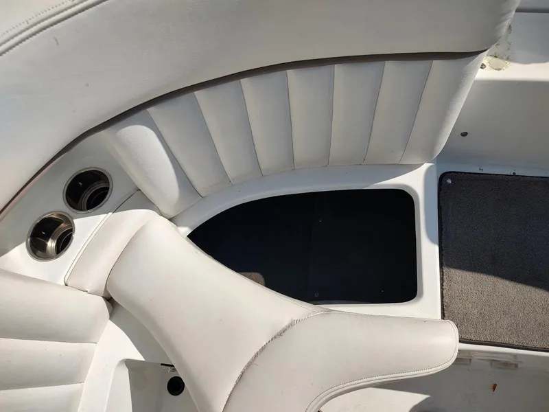 Slide: The Image of White leather seating and carpeted floor in 2000 Cobalt 262 boat interior. - 21