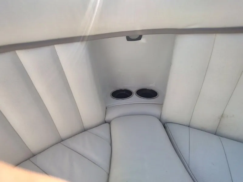 Slide: The Image of White leather boat seating with cup holders, Cobalt 262, 2000 model. - 26