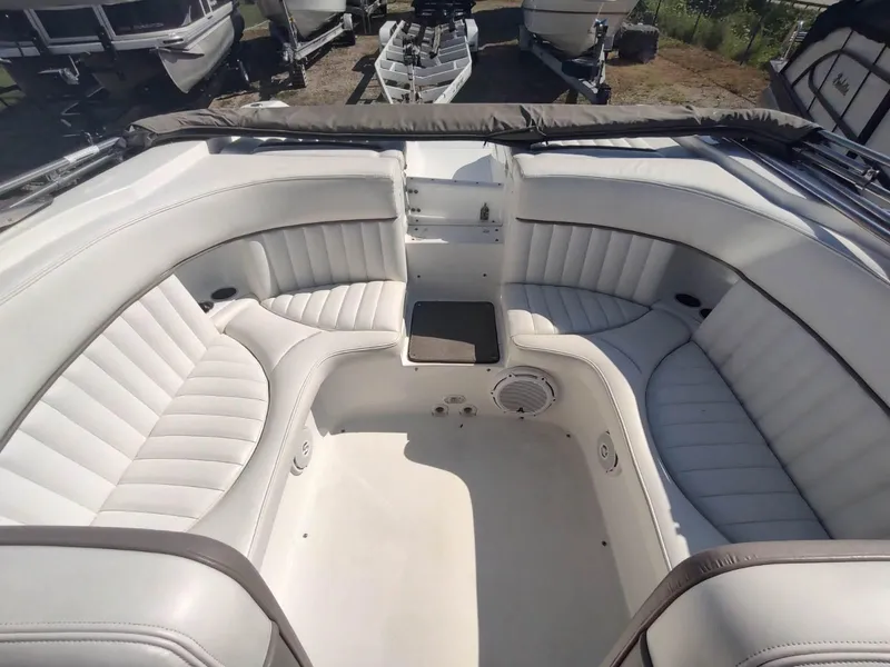 Slide: The Image of Interior of a 2000 Cobalt 262 boat with white leather seating. - 4