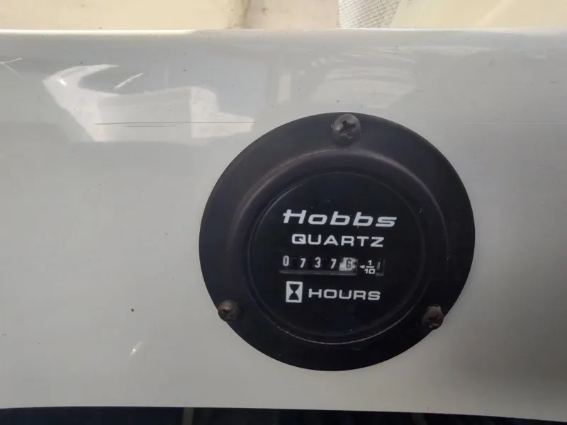 Slide: The Image of Hobbs Quartz hour meter on 2000 Cobalt 262, displaying 737.6 hours. - 5