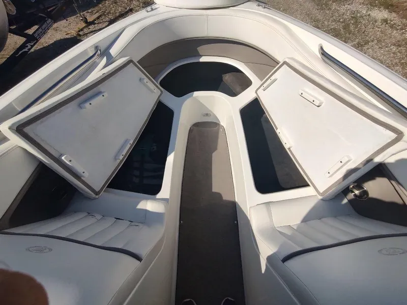 Slide: The Image of Interior of a 2000 Cobalt 262 boat with open storage compartments. - 8