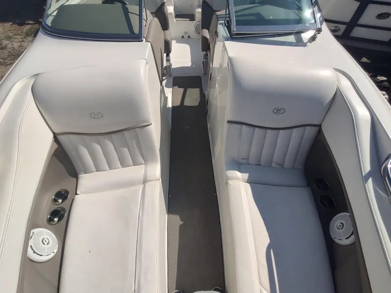 Slide: The Image of Interior of a 2000 Cobalt 262 boat with white leather seating. - 9