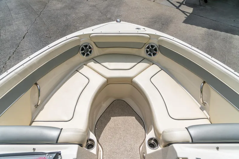Slide: The Image of Bow seating area of 2009 Sea Ray 210 Select boat with cushioned seats and speakers. - 18