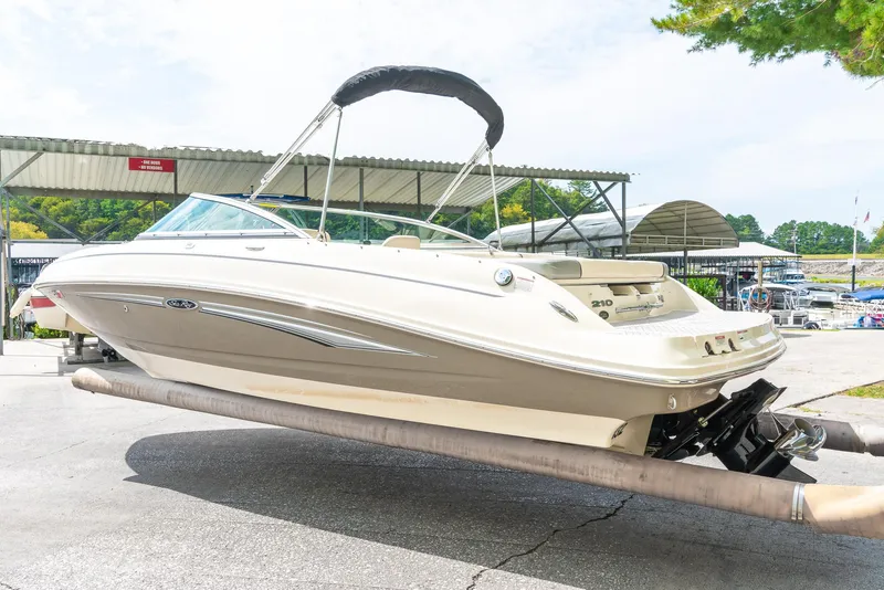 Slide: The Image of 2009 Sea Ray 210 Select boat on trailer at marina, side view. - 6