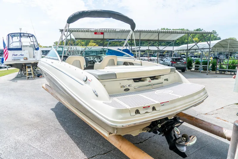 Slide: The Image of 2009 Sea Ray 210 Select boat on display at a marina. - 7