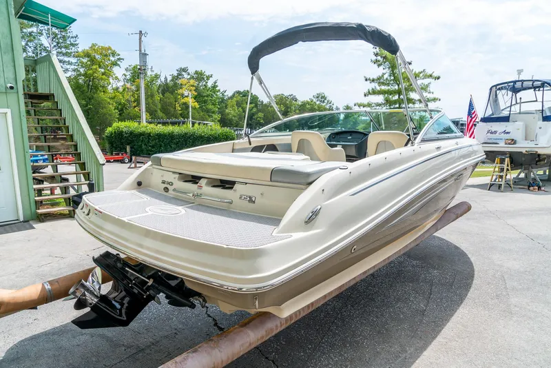 Slide: The Image of 2009 Sea Ray 210 Select boat on trailer, outdoor setting, sunny day. - 8