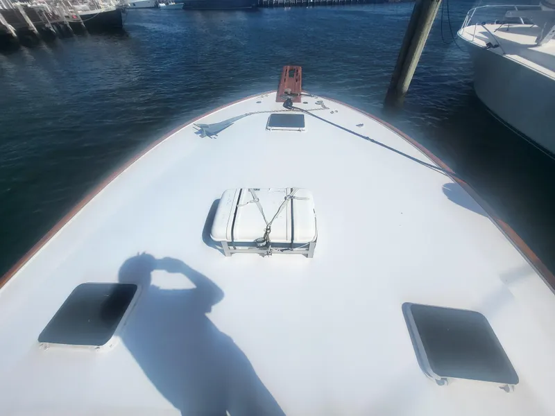 Slide: The Image of 1989 Ocean Yachts 48 boat deck with hatches, docked in marina. - 12