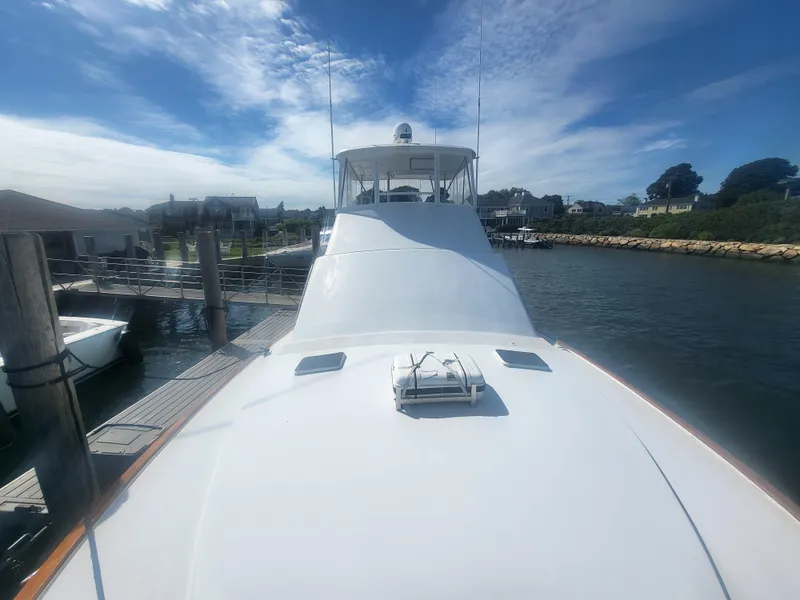 Slide: The Image of 1989 Ocean Yachts 48 docked at marina under clear blue sky. - 15