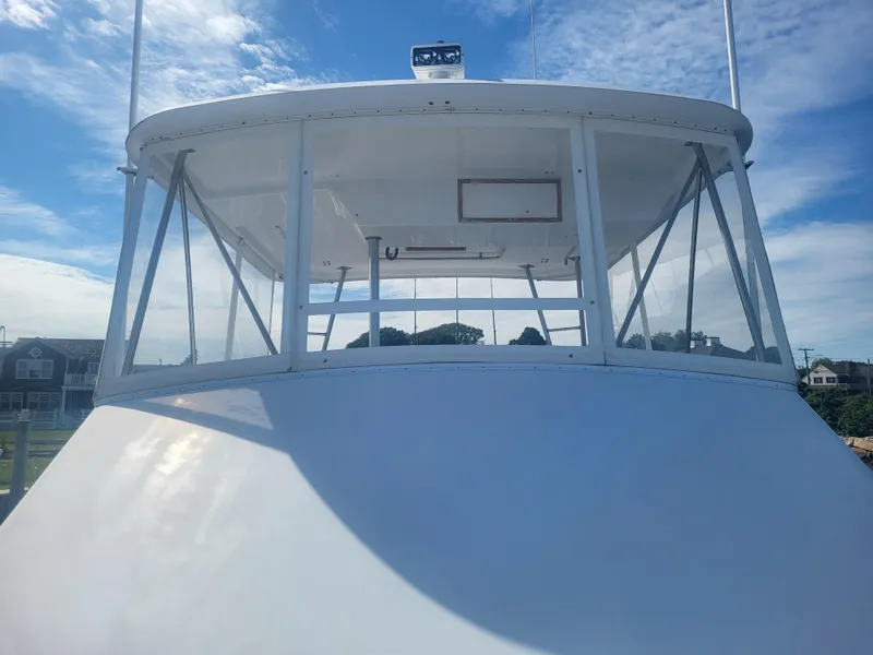 Slide: The Image of 1989 Ocean Yachts 48 boat bridge with clear skies and coastal background. - 18