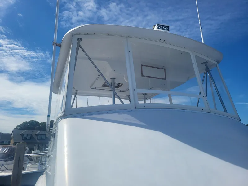 Slide: The Image of 1989 Ocean Yachts 48 boat with clear blue sky background. - 19