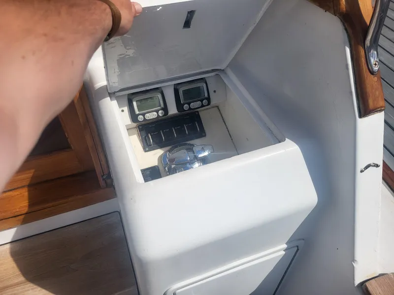 Slide: The Image of Control panel of a 1989 Ocean Yachts 48, featuring gauges and switches. - 24