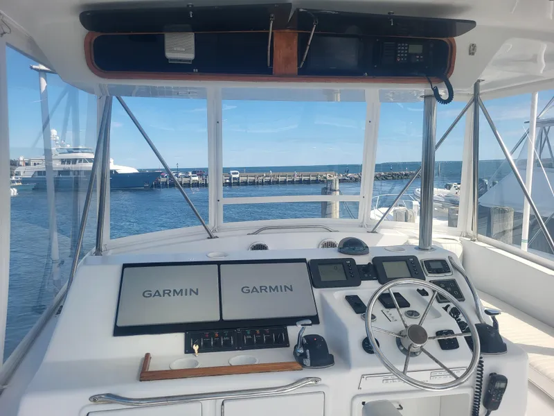 Slide: The Image of Cockpit of 1989 Ocean Yachts 48 with Garmin navigation, docked at marina. - 29