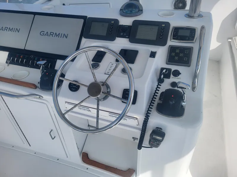 Slide: The Image of Control panel of a 1989 Ocean Yachts 48 with Garmin navigation systems. - 33