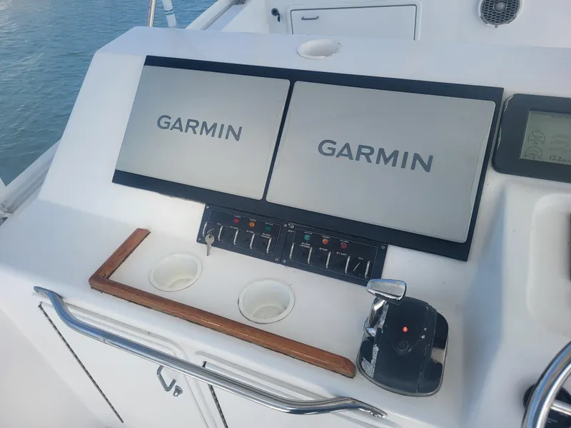 Slide: The Image of Control panel of a 1989 Ocean Yachts 48 with dual Garmin displays. - 34