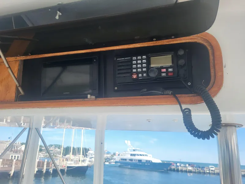 Slide: The Image of Control panel on a 1989 Ocean Yachts 48, featuring navigation and communication equipment. - 36