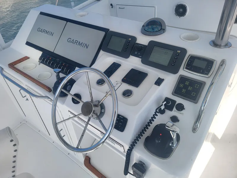Slide: The Image of Control panel of a 1989 Ocean Yachts 48 with Garmin navigation systems. - 40