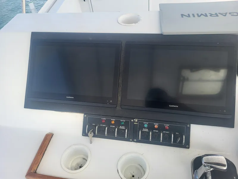 Slide: The Image of Control panel of a 1989 Ocean Yachts 48 with dual Garmin screens. - 41