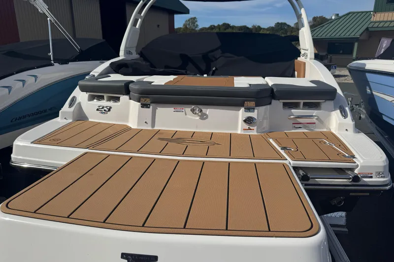 Slide: The Image of 2026 Chaparral 23 SSi boat with spacious deck and sleek design. - 20
