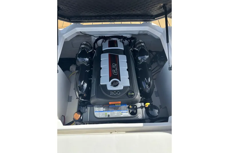 Slide: The Image of Engine compartment of 2026 Chaparral 23 SSi boat, featuring a powerful 6.2L engine. - 22