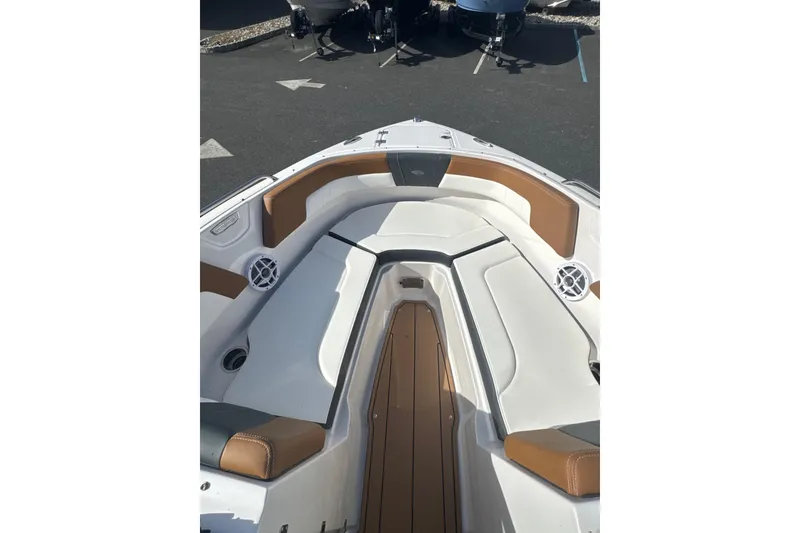 Slide: The Image of 2026 Chaparral 23 SSi boat interior with white and brown seating, showcasing modern design. - 29
