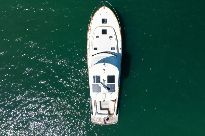 Slide: The Image of Overhead view of 2014 Hinckley Talaria 48 Flybridge yacht on open water. - 8