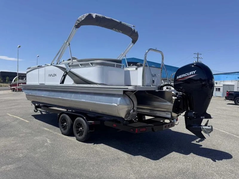 Slide: The Image of 2025 Avalon 2385 25 LSZ QL pontoon boat on trailer, featuring Mercury outboard motor. - 3