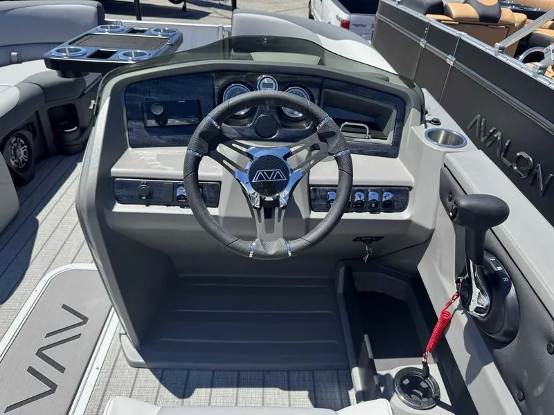 Slide: The Image of 2025 Avalon 2385 25 LSZ QL boat dashboard with steering wheel and controls. - 8