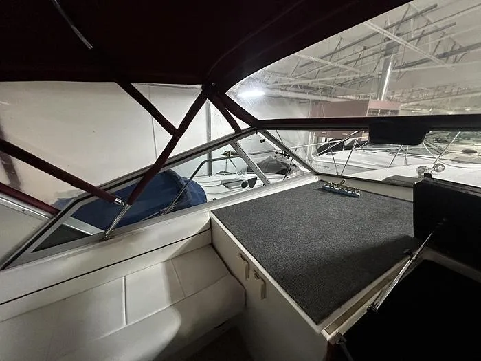 Slide: The Image of Interior view of 1990 Carver 3257 Montego boat with seating and dashboard. - 17
