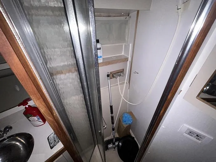 Slide: The Image of Bathroom interior of 1990 Carver 3257 MONTEGO boat with shower and sink. - 31