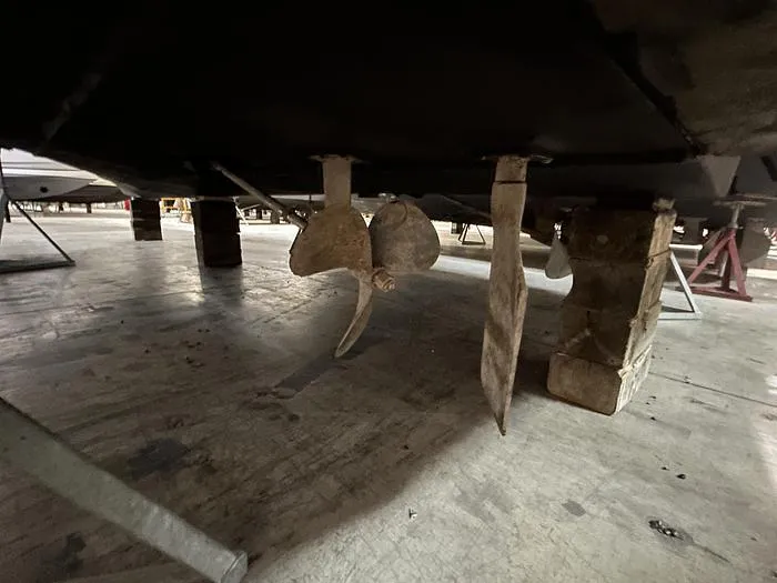 Slide: The Image of Underside view of a 1990 Carver 3257 MONTEGO boat showing propeller and rudder. - 6