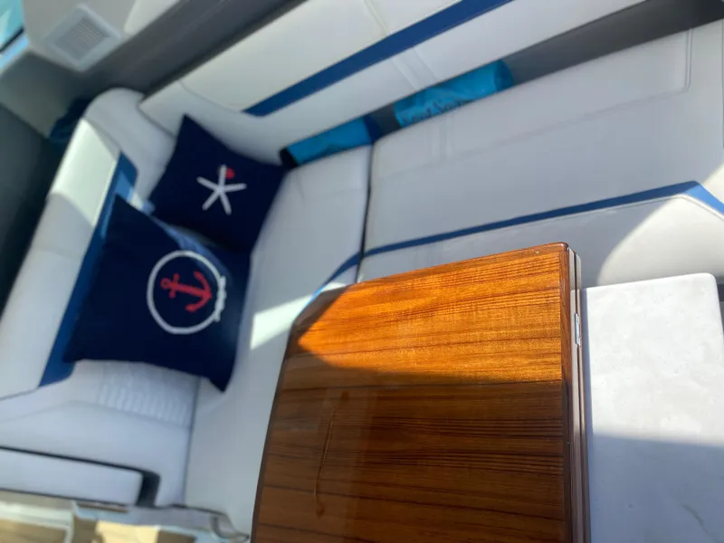 Slide: The Image of Luxurious interior of 2021 Tiara Yachts 38LX with nautical-themed cushions. - 13