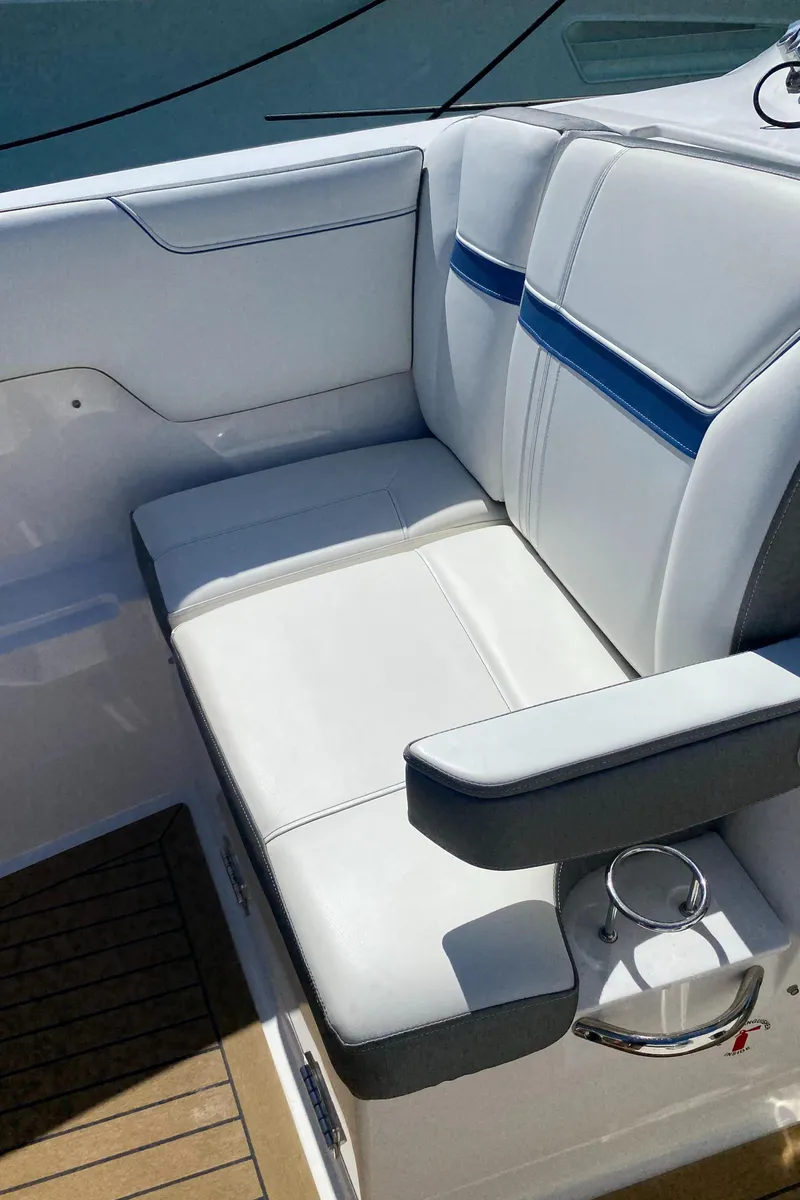 Slide: The Image of 2021 Tiara Yachts 38LX boat seating with white and blue upholstery. - 14